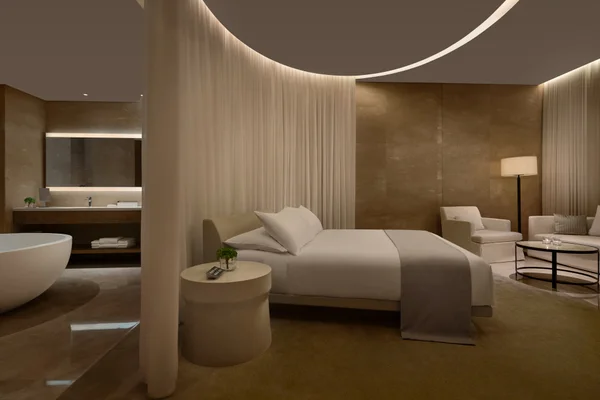 The Sanya Edition loft room at night with city views Hainan Island China