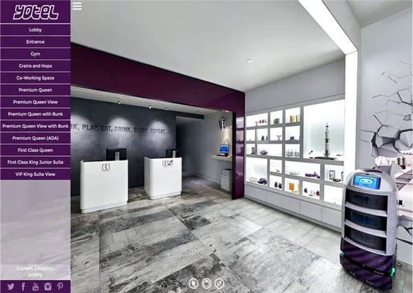 Hotel room virtual tour at Yotel Singapore Orchard showing bedroom with pendant lamps and illuminated city skyline